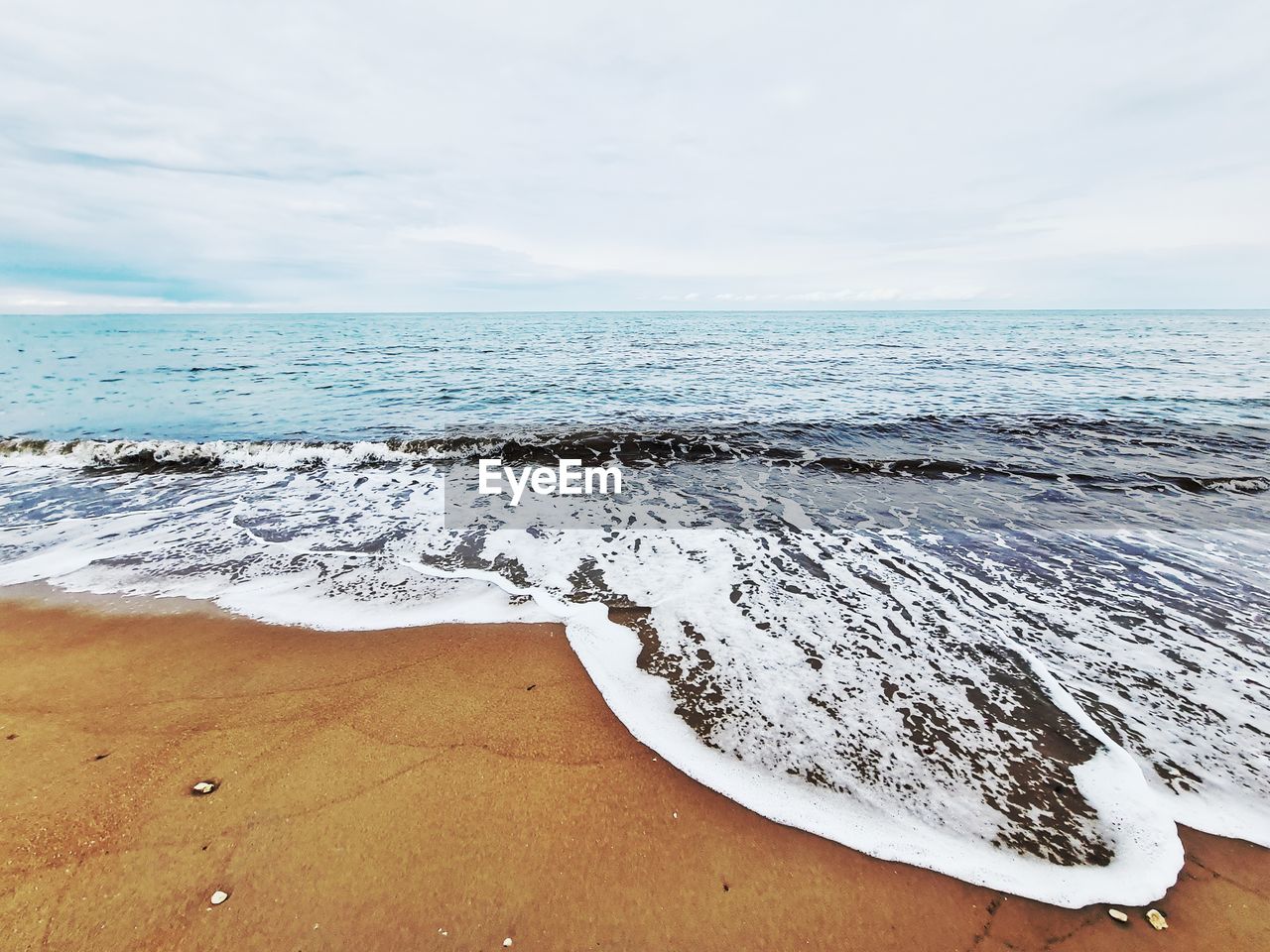 sea, water, land, beach, sky, scenics - nature, beauty in nature, ocean, shore, horizon over water, wave, horizon, sand, nature, wind wave, cloud, tranquility, coast, tranquil scene, body of water, day, no people, motion, water sports, idyllic, sports, outdoors, non-urban scene, environment, travel destinations, travel, landscape