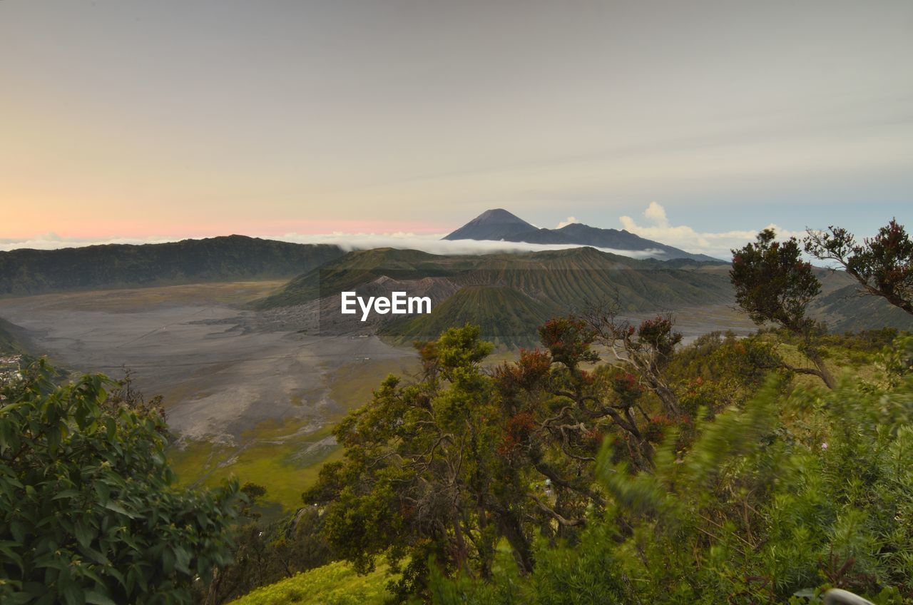 Scenic view of landscape against sky during sunset