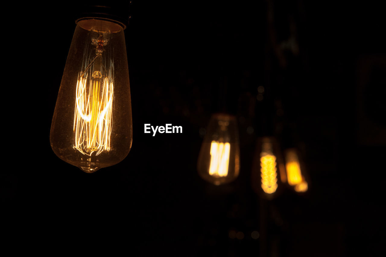 Close-up of illuminated light bulb