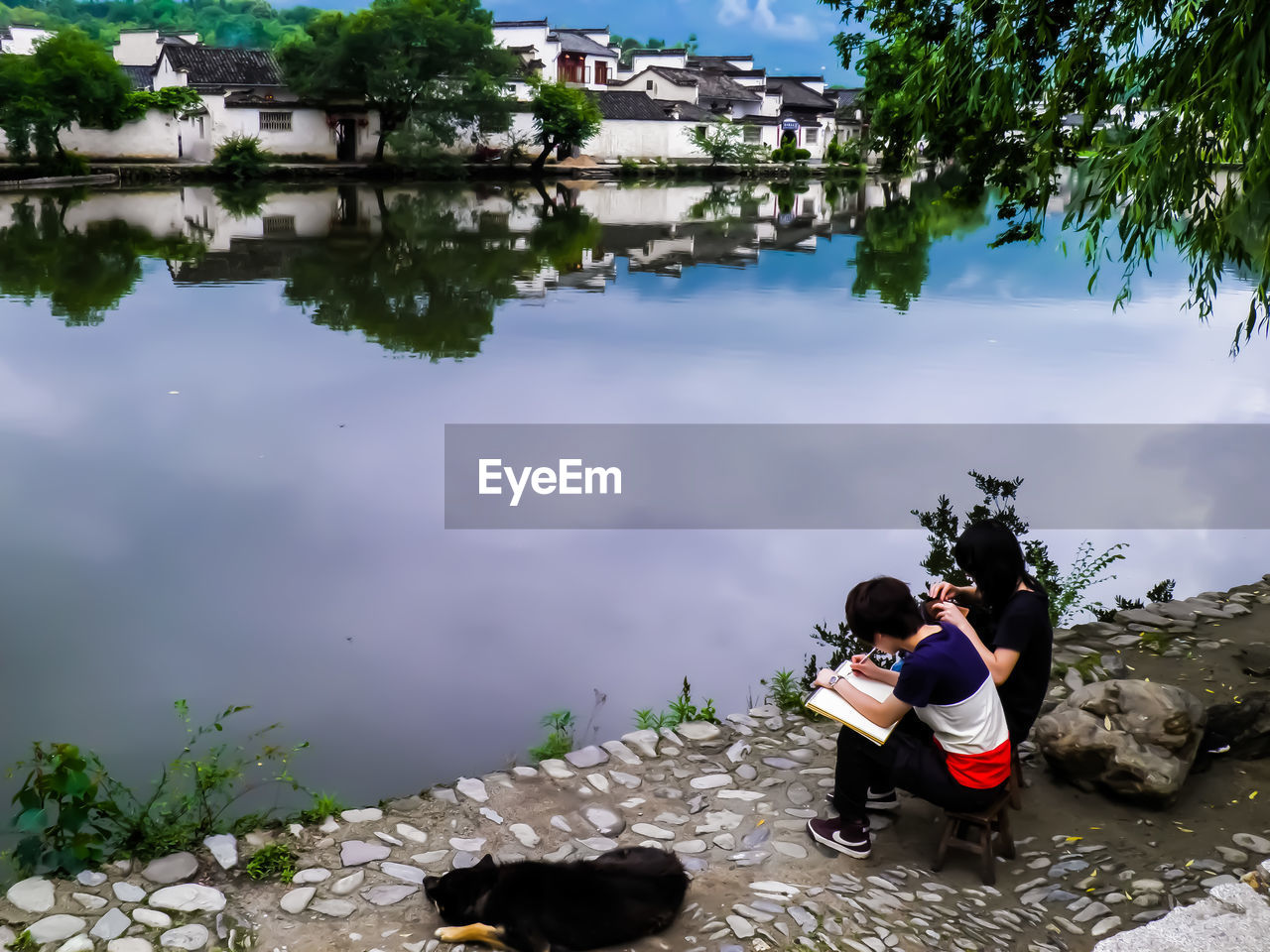 REFLECTION OF WOMEN AND WOMAN IN LAKE