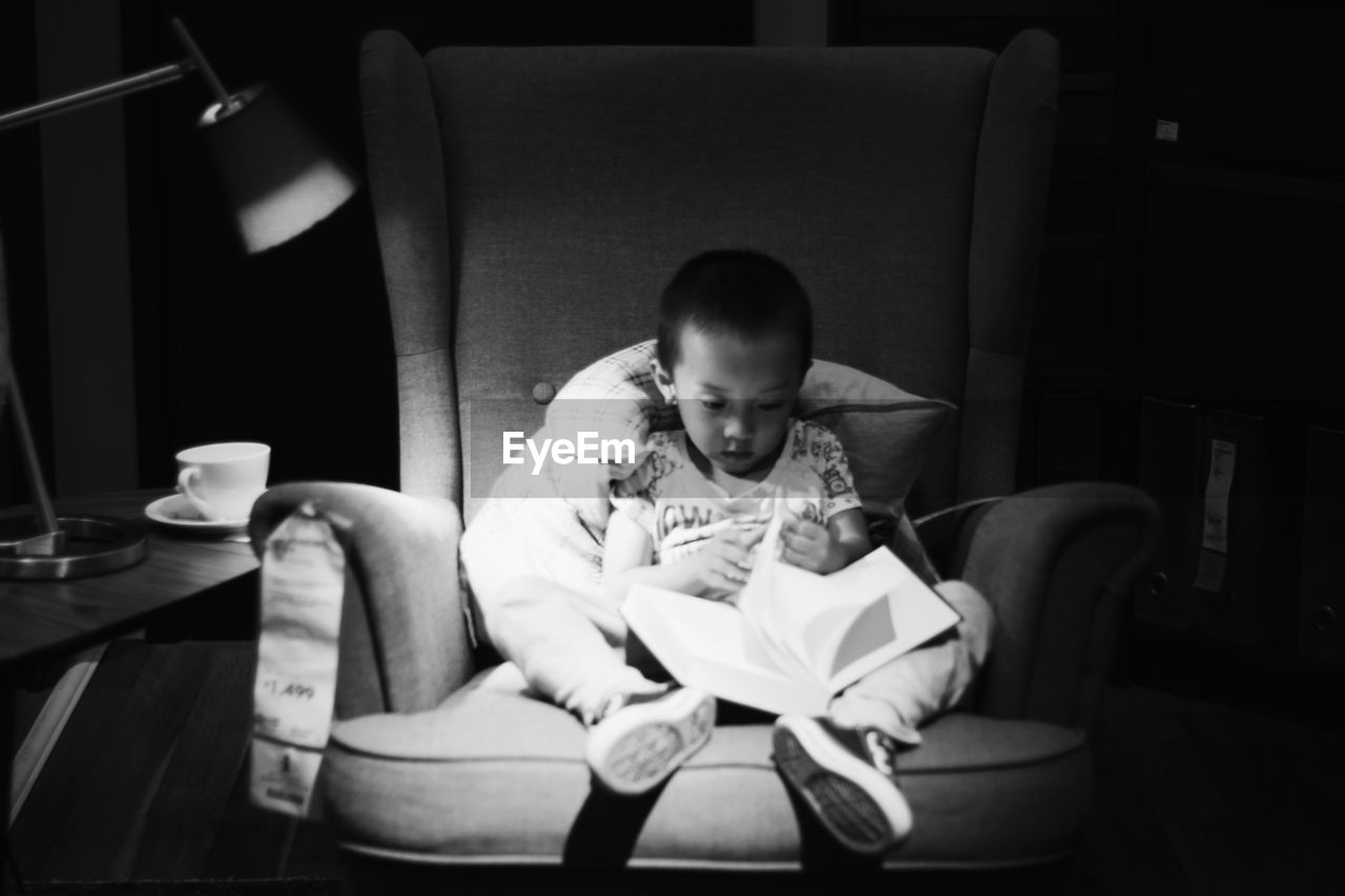 PORTRAIT OF GIRL SITTING ON CHAIR