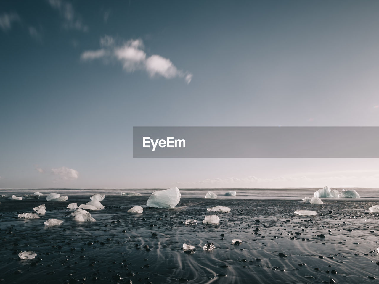 SCENIC VIEW OF SEA SHORE AGAINST SKY