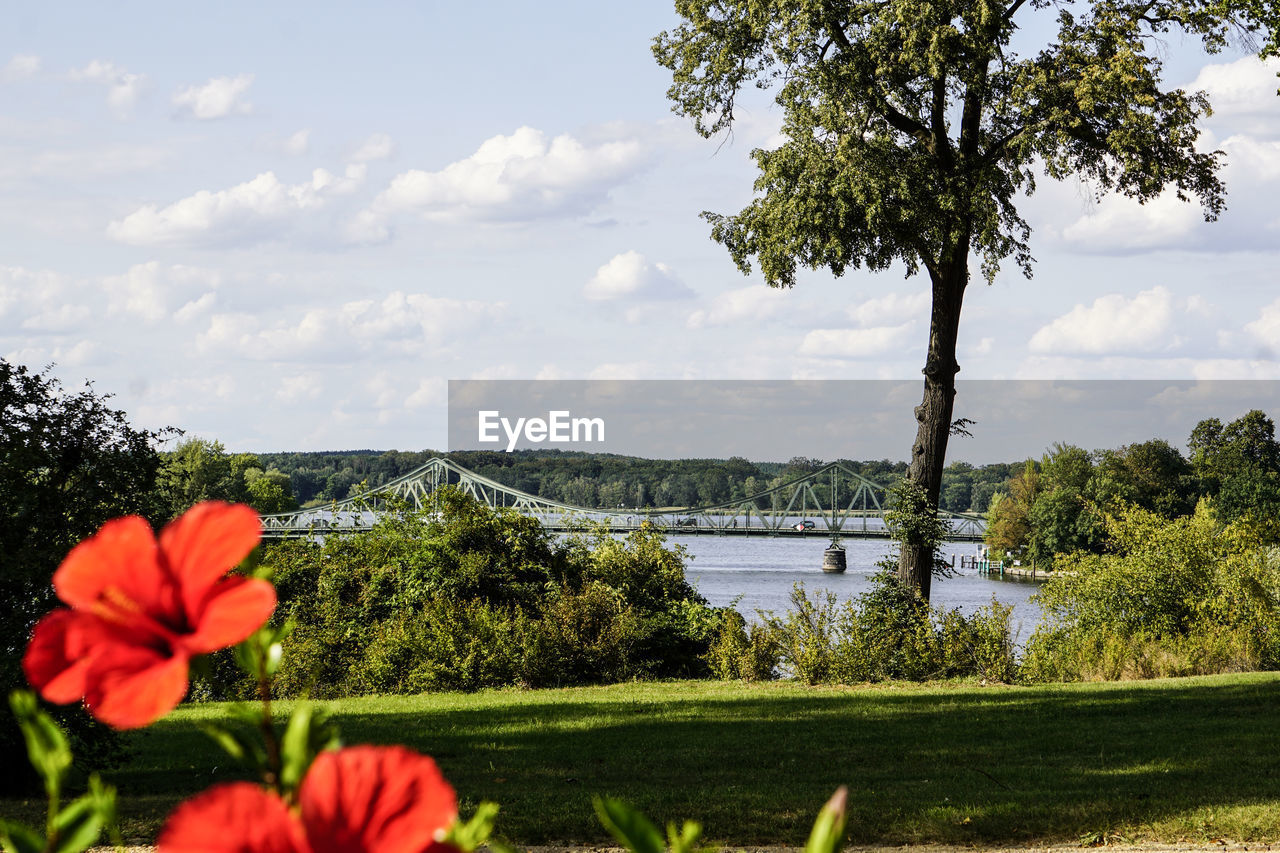 Scenic view of lake against cloudy sky