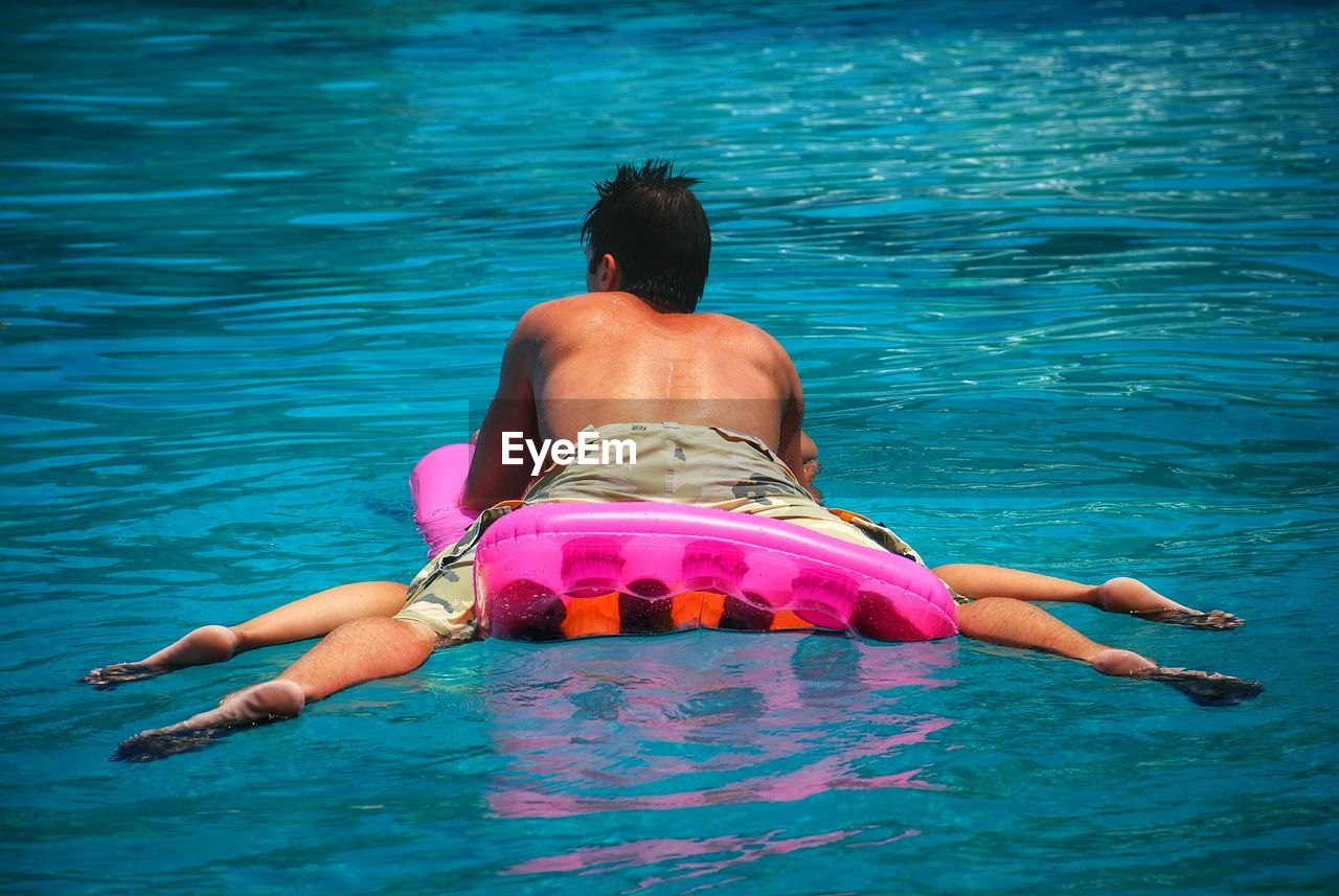 People relaxing on sea