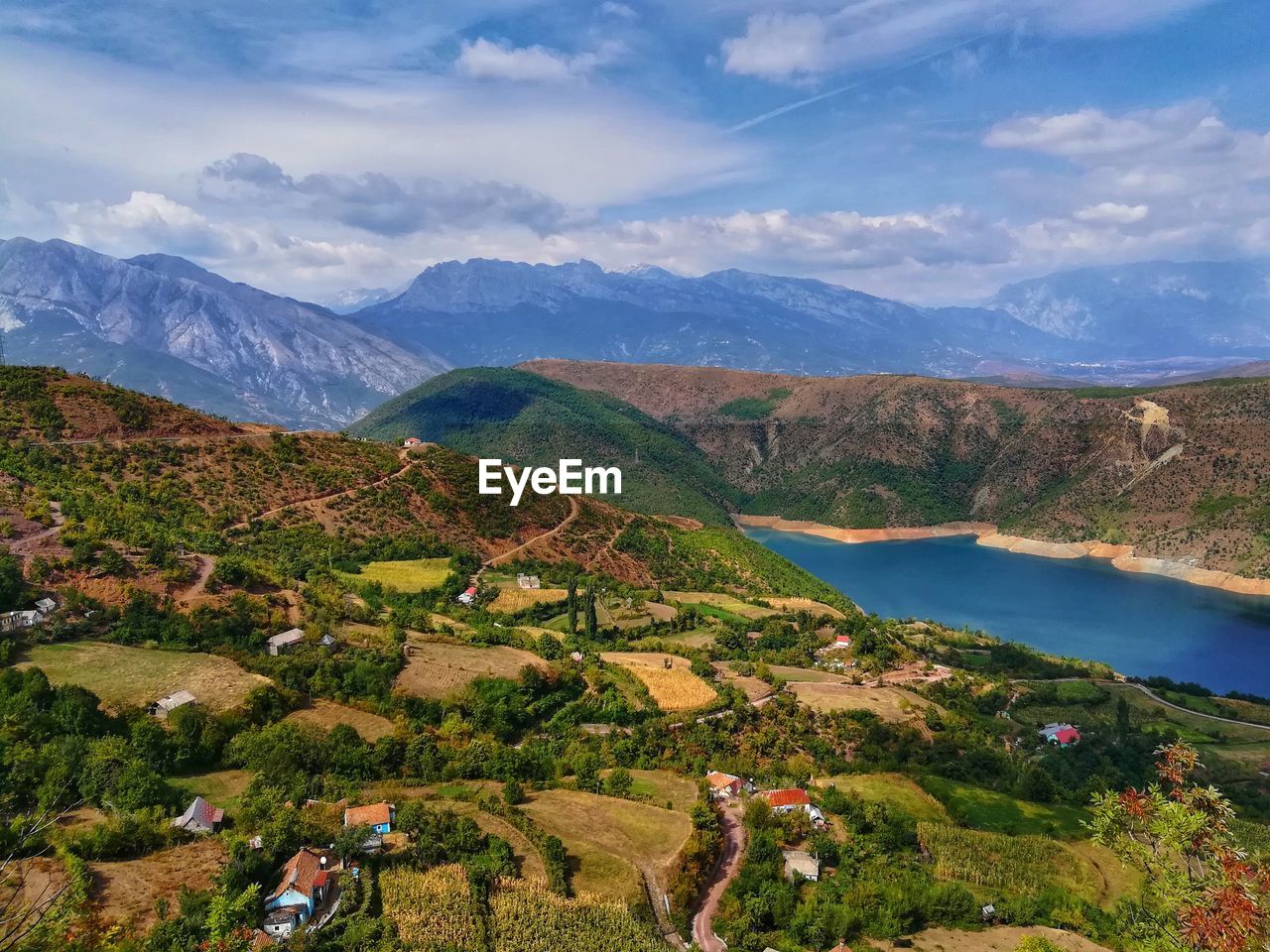 Scenic view of landscape and mountains against sky