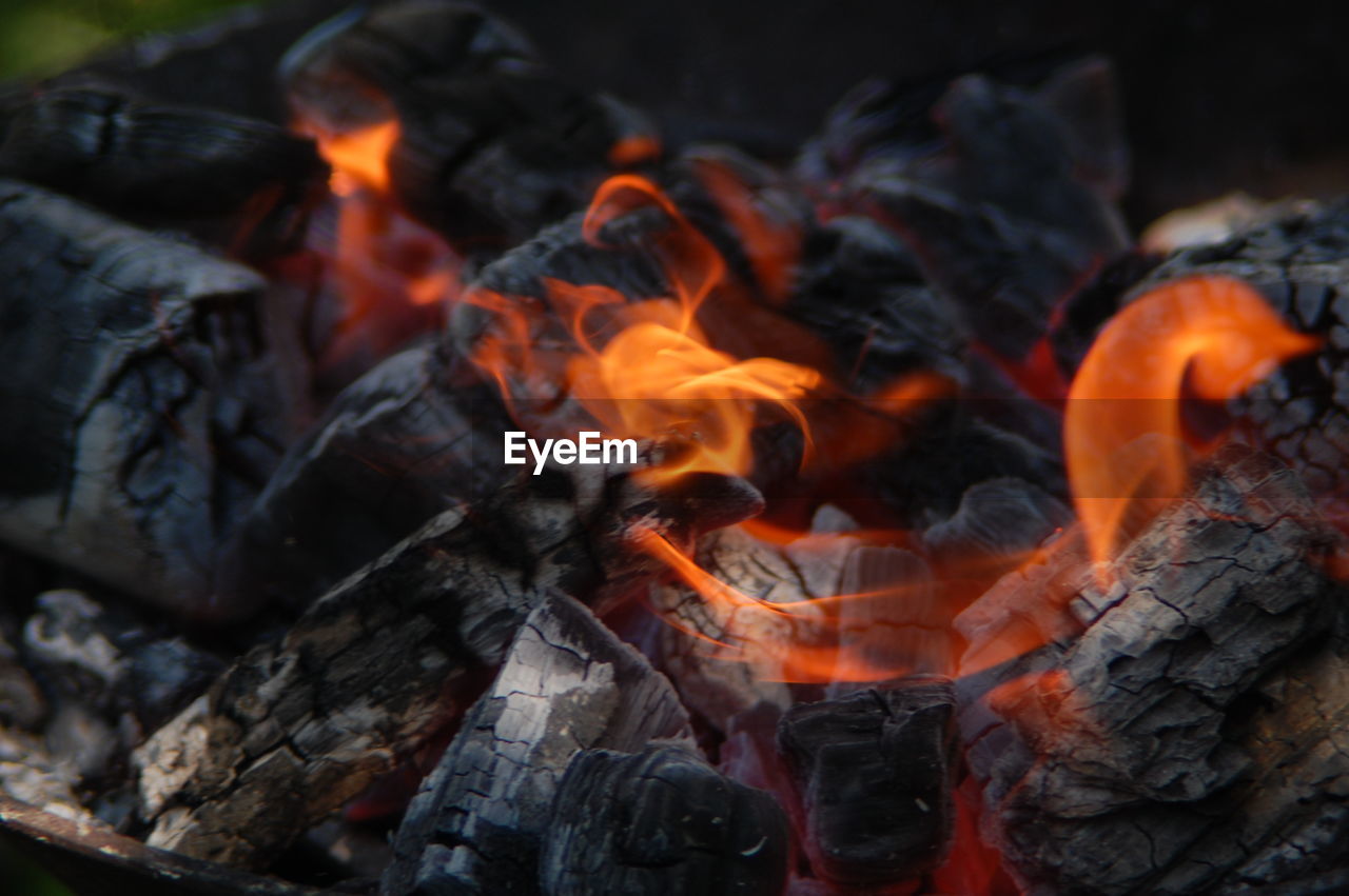 CLOSE-UP OF BONFIRE AT FIRE