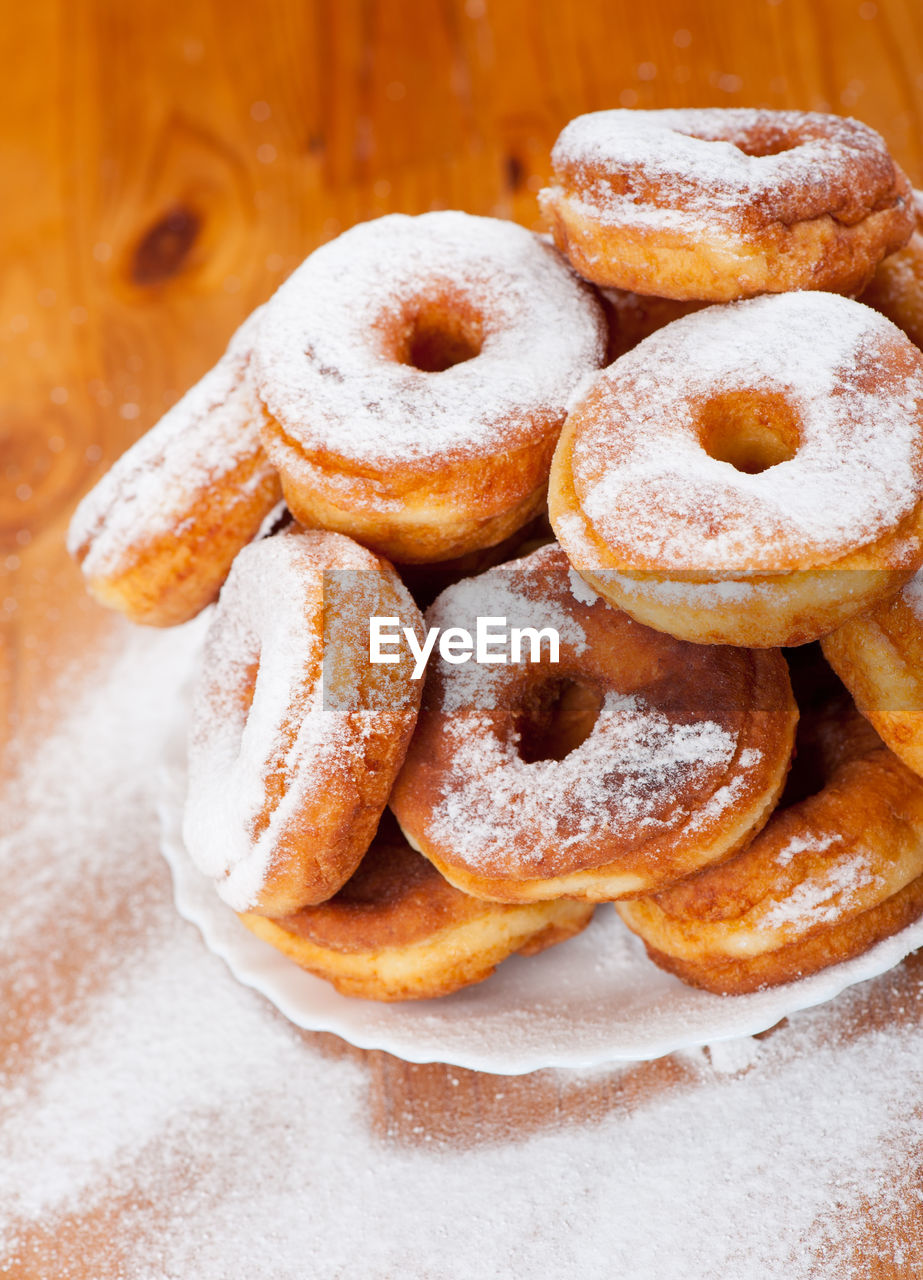 Close-up of donuts on wooden table