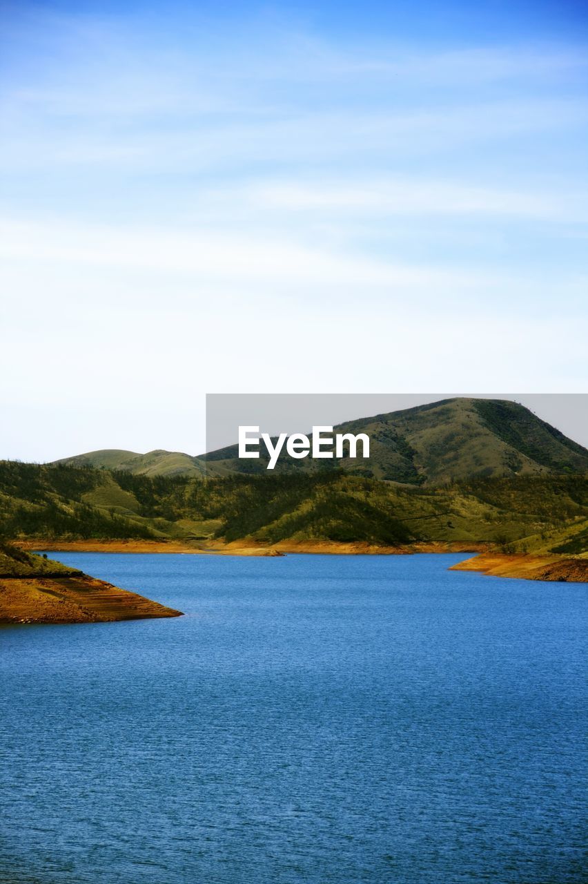 Scenic view of lake and mountain against sky