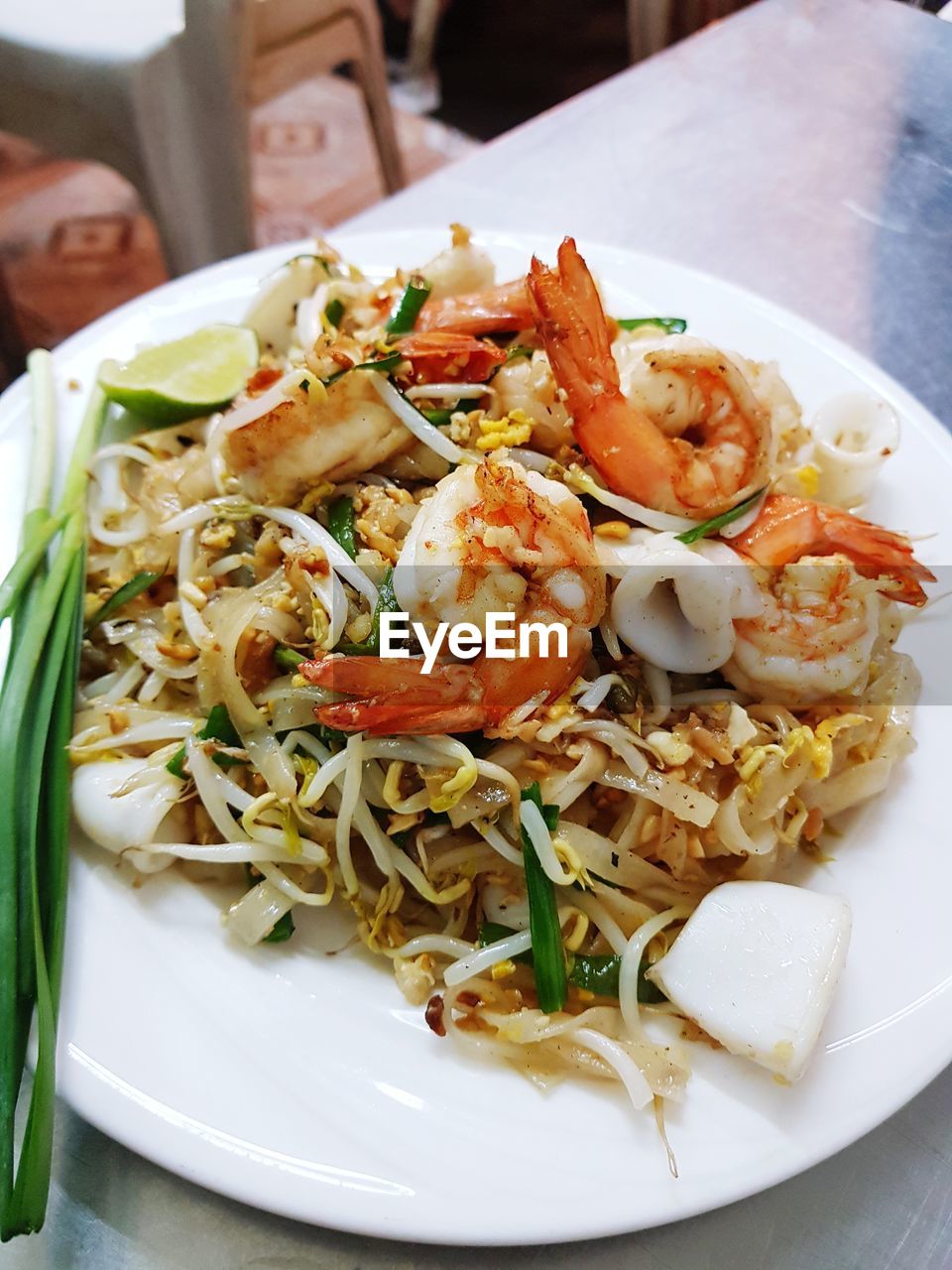 CLOSE-UP OF PASTA WITH SALAD SERVED IN PLATE