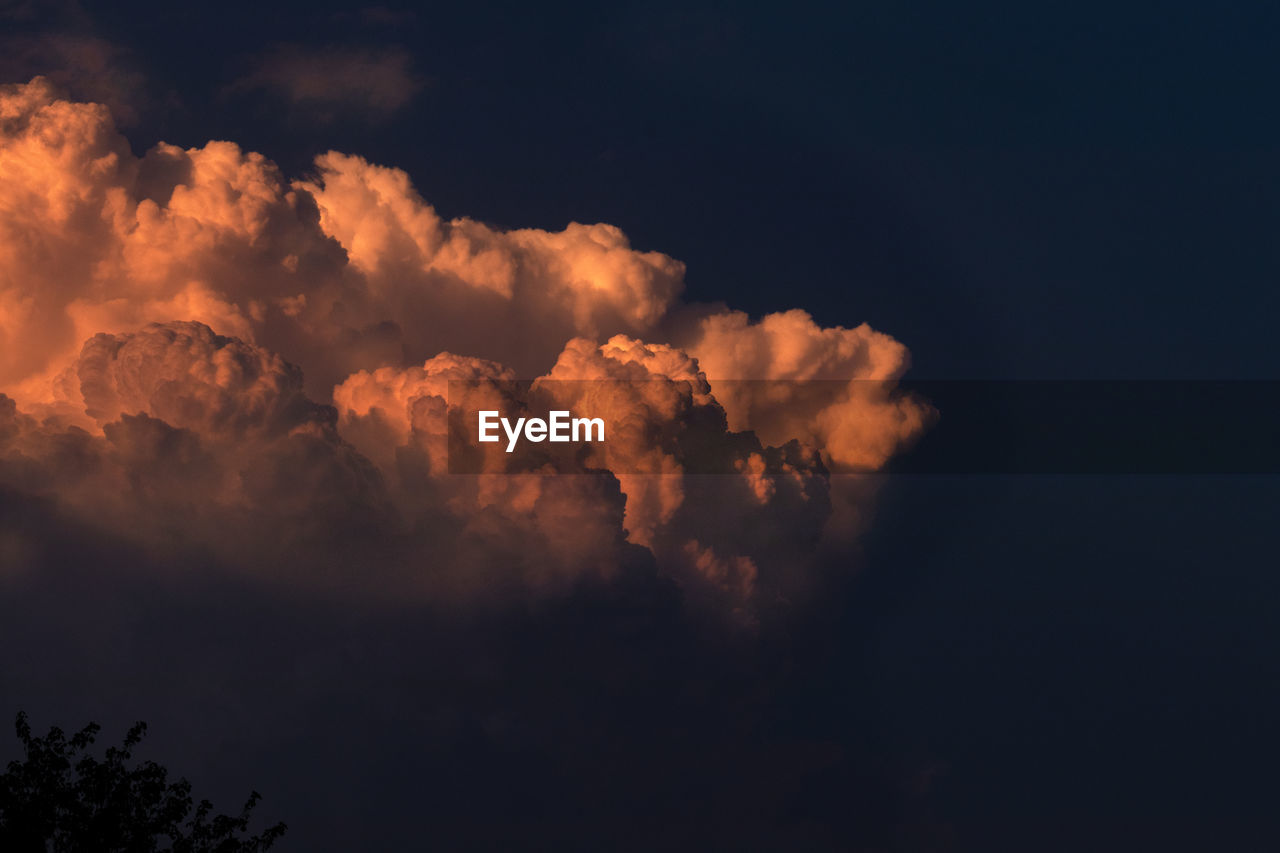 Low angle view of a cloud in sky during sunset