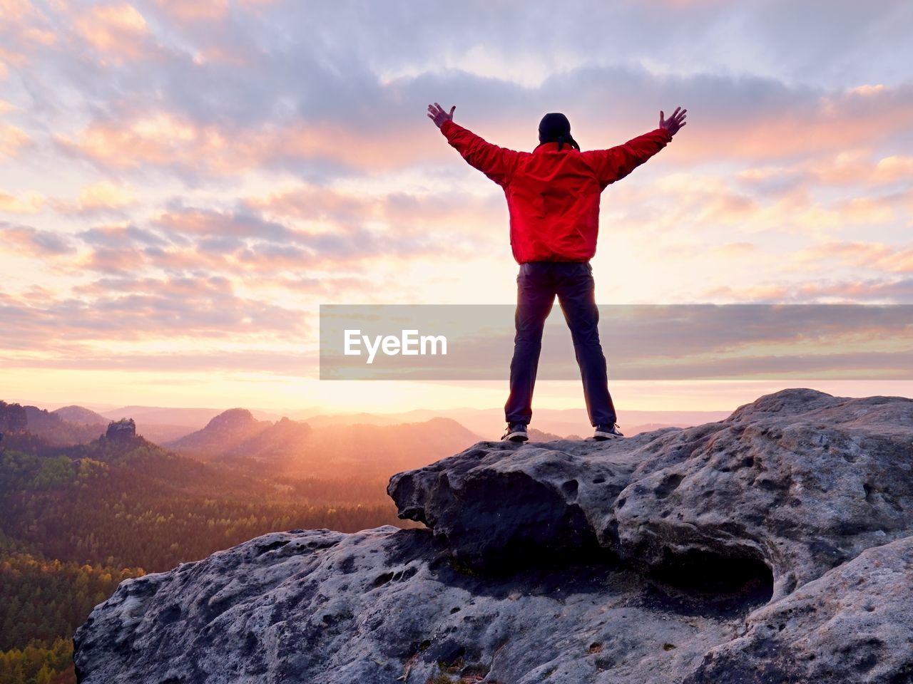 Male hiker walking on top of mountain looking at beauty morning landscape. man hiking silhouette