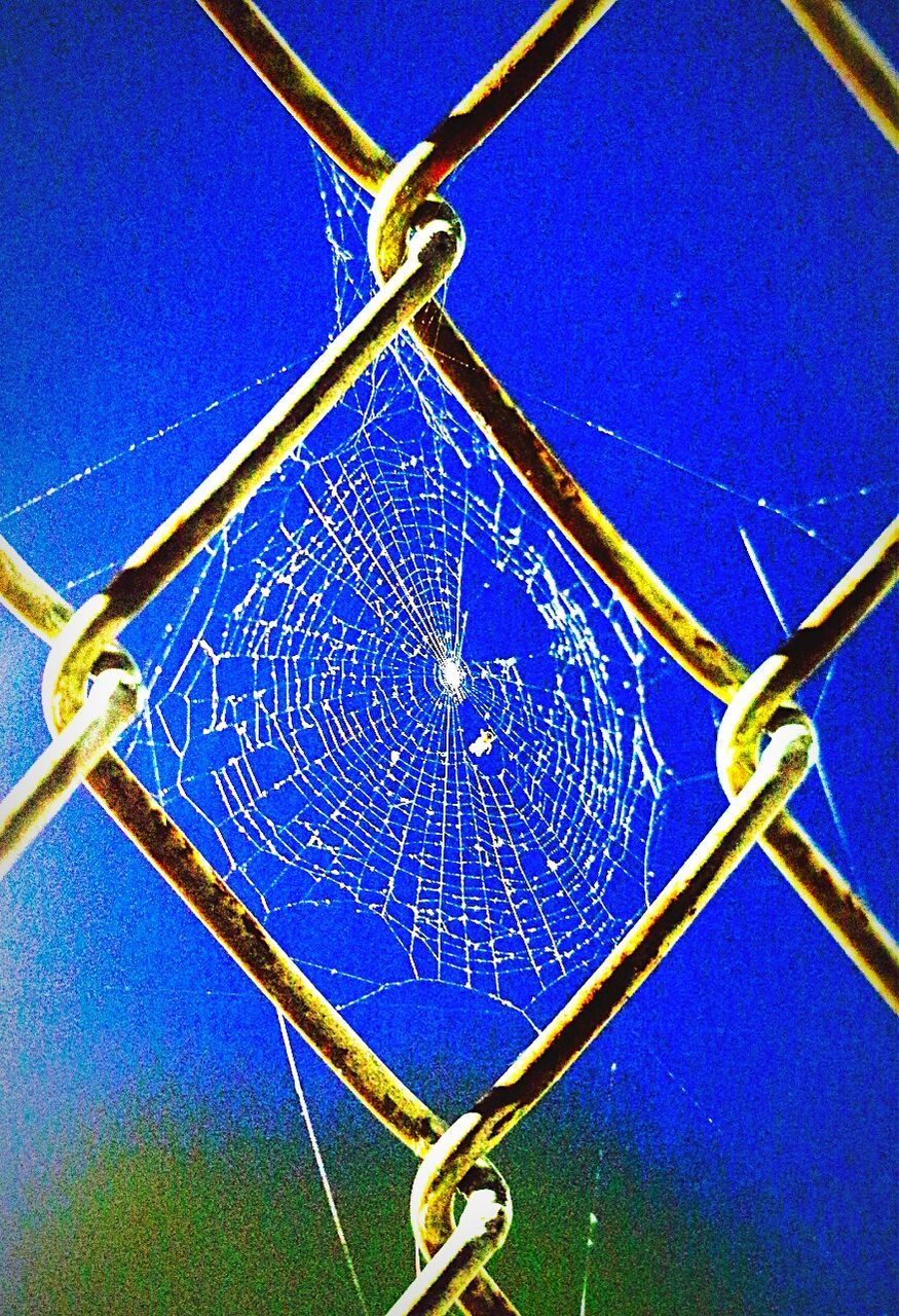 LOW ANGLE VIEW OF METALLIC STRUCTURE ON THE WALL