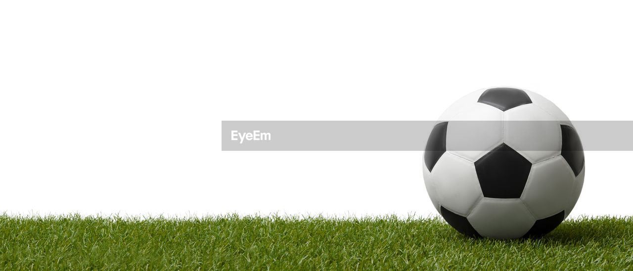 CLOSE-UP OF SOCCER BALL IN FIELD