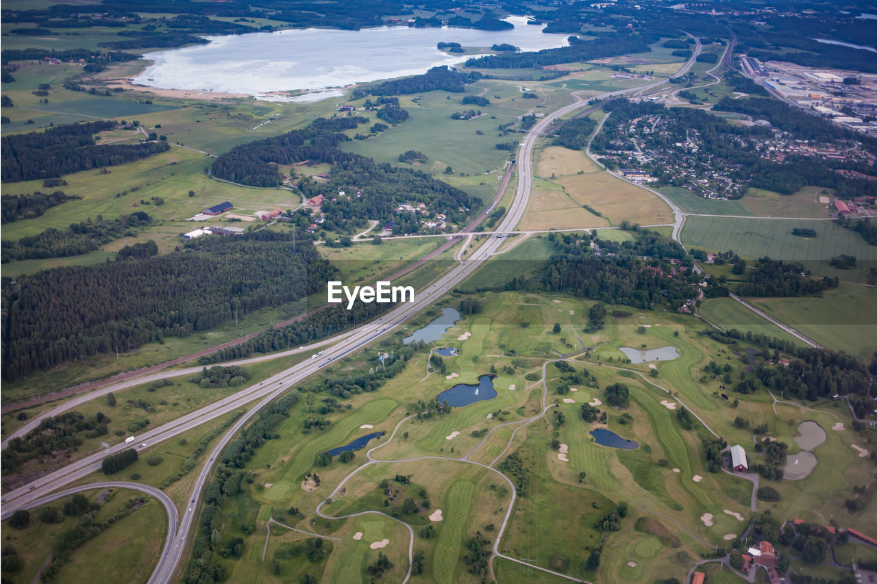 Aerial view of lake by field