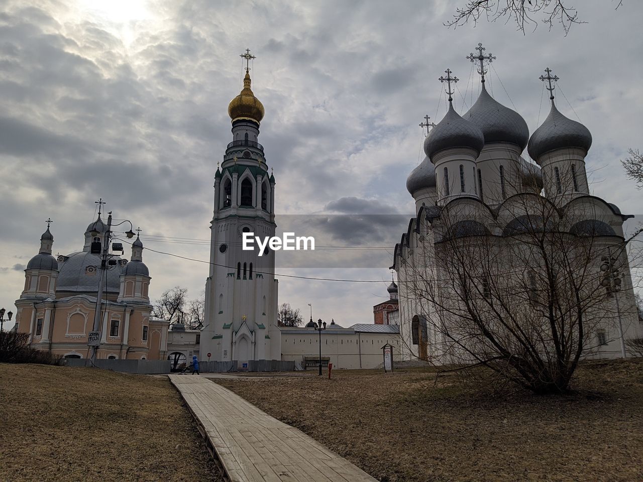 View of buildings against cloudy sky