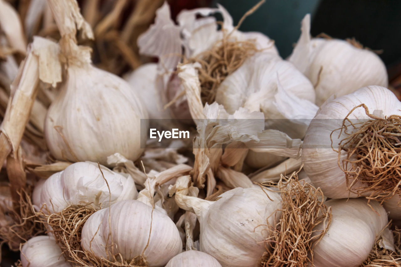 Close-up of garlic bulbs for sale in market