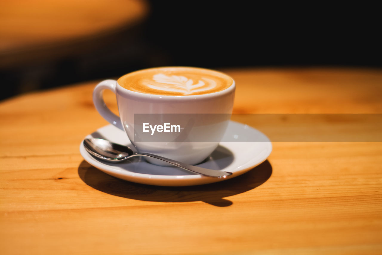 COFFEE CUP ON TABLE