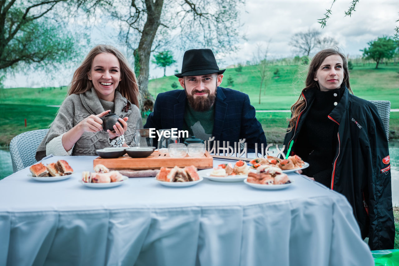 PEOPLE SITTING ON TABLE