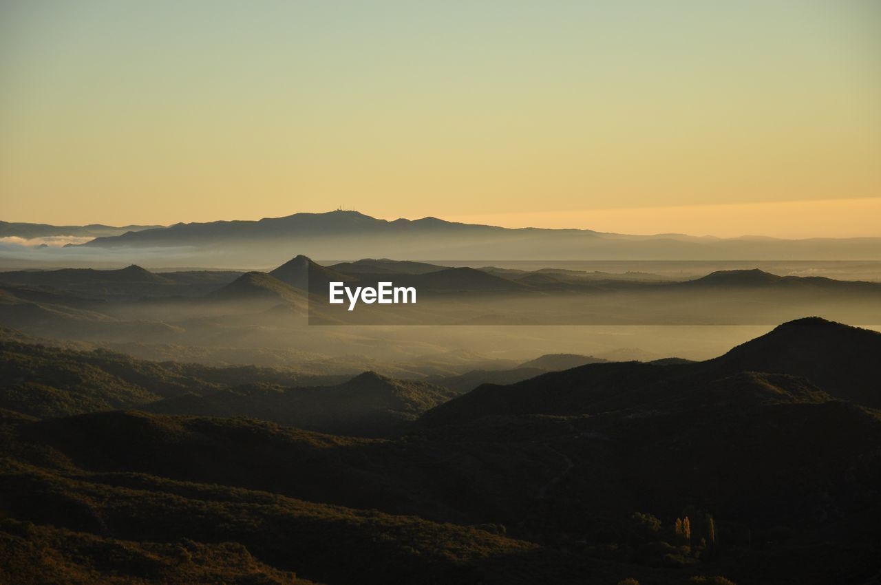 Scenic view of mountains at sunset