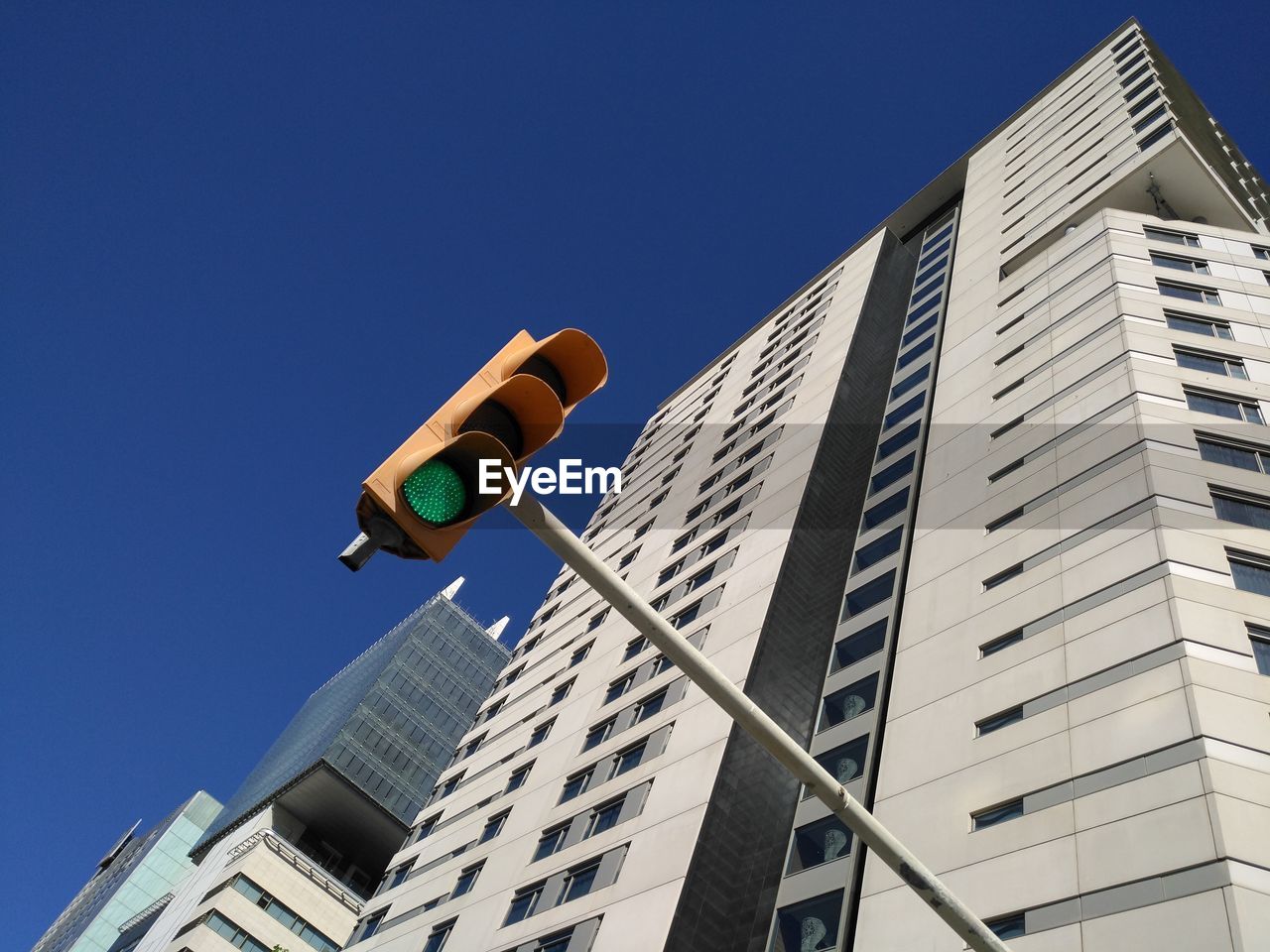 Low angle view of skyscraper against clear sky