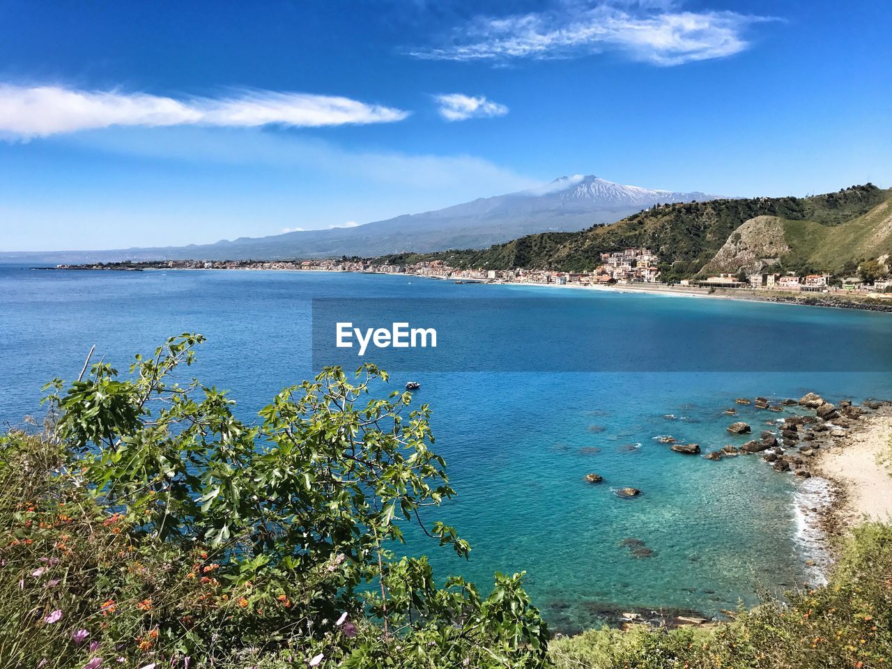 High angle view of sea against blue sky