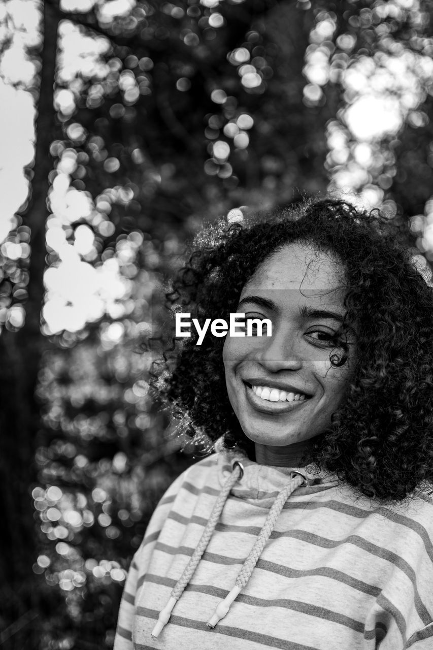 Black and white portrait of a smiling young woman