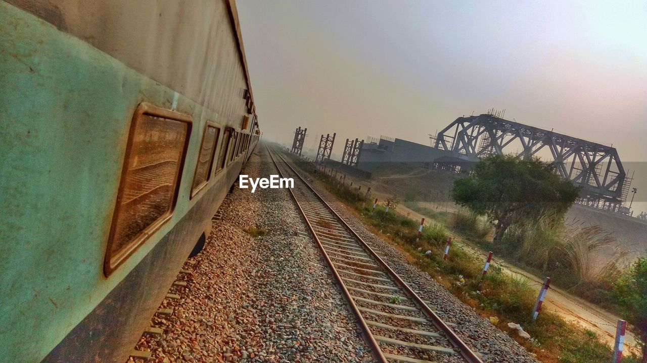 RAILROAD TRACK AGAINST SKY