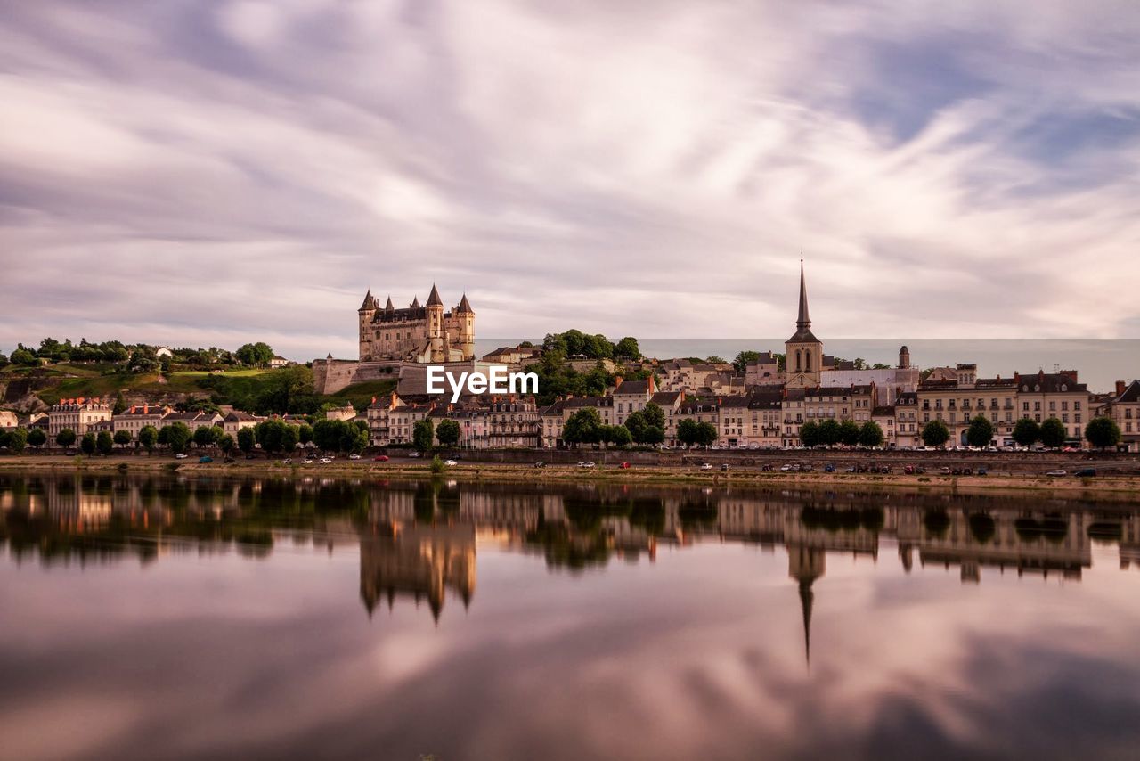 RIVER WITH BUILDINGS IN BACKGROUND