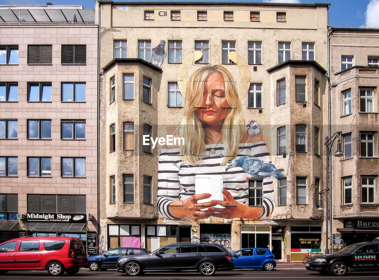 WOMAN ON A BUILDING