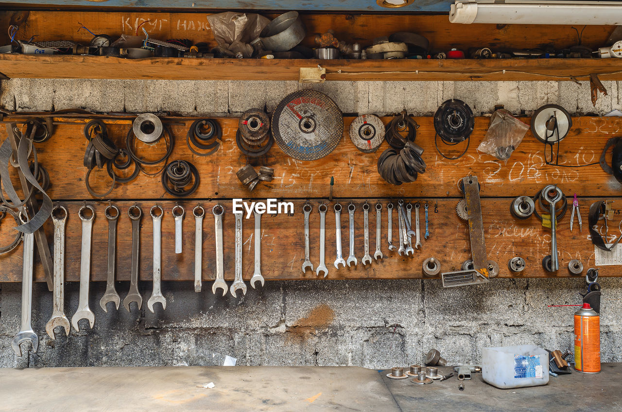 Collection of various repair tools hanging on wall. workshop with tools.