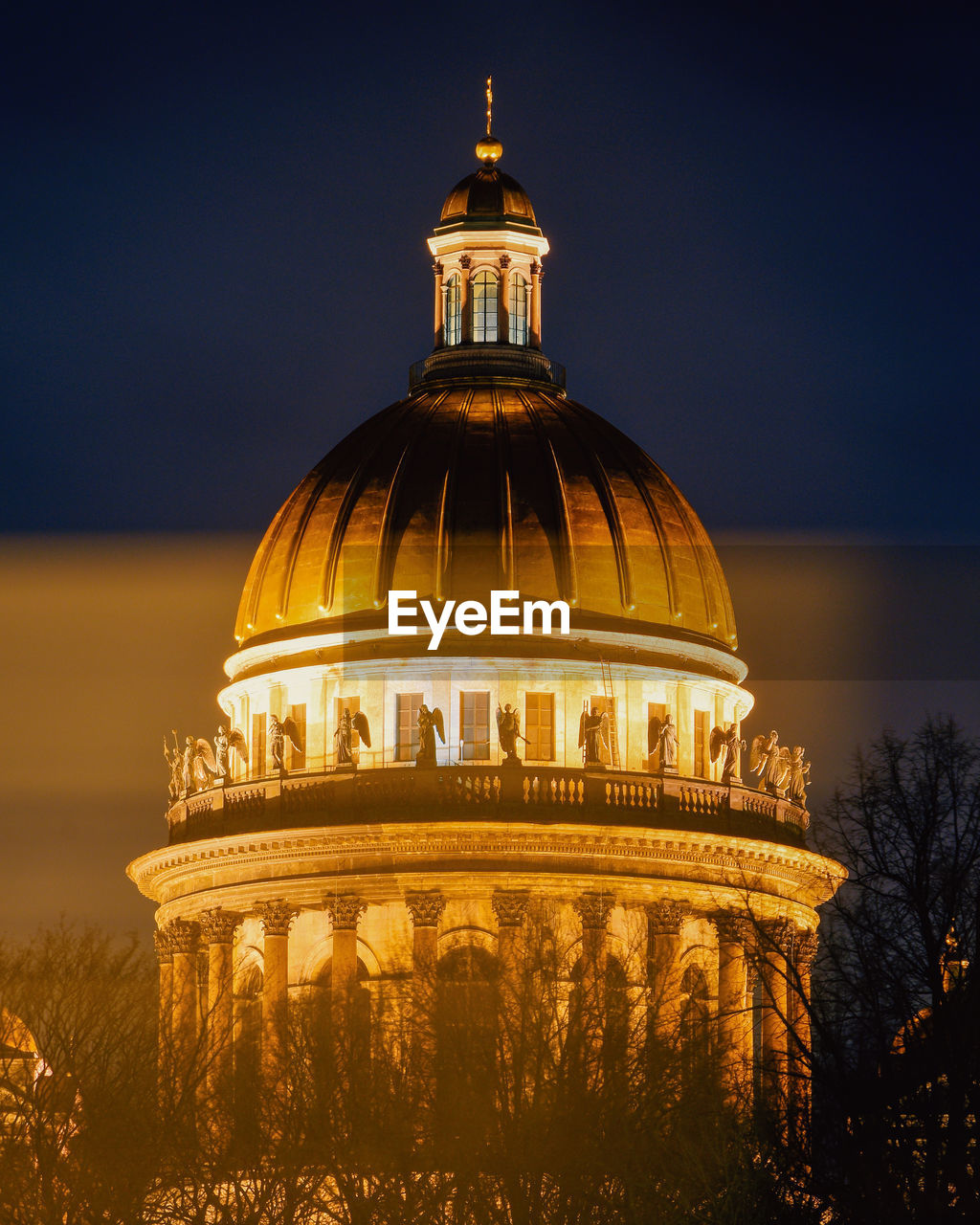 BUILDING AGAINST SKY AT NIGHT