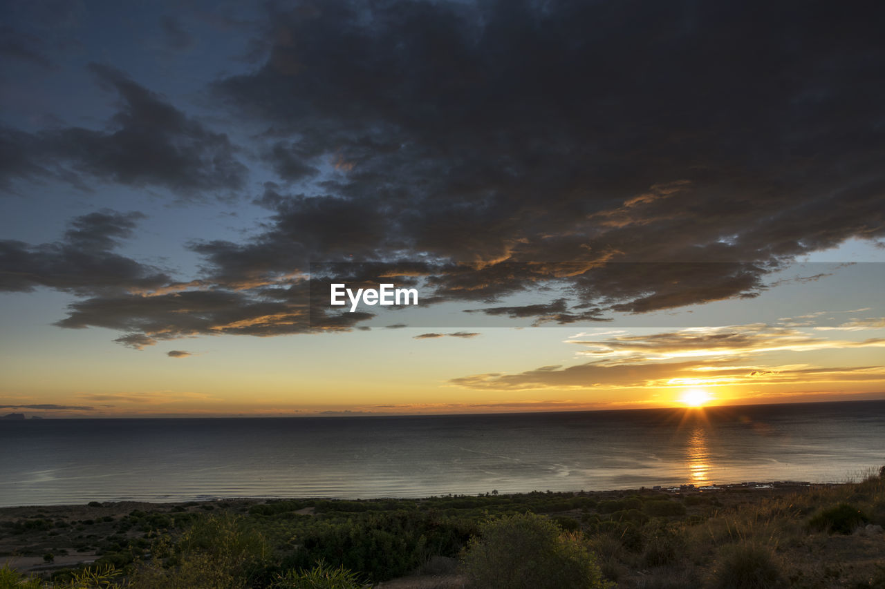 Scenic view of sea against sky during sunset