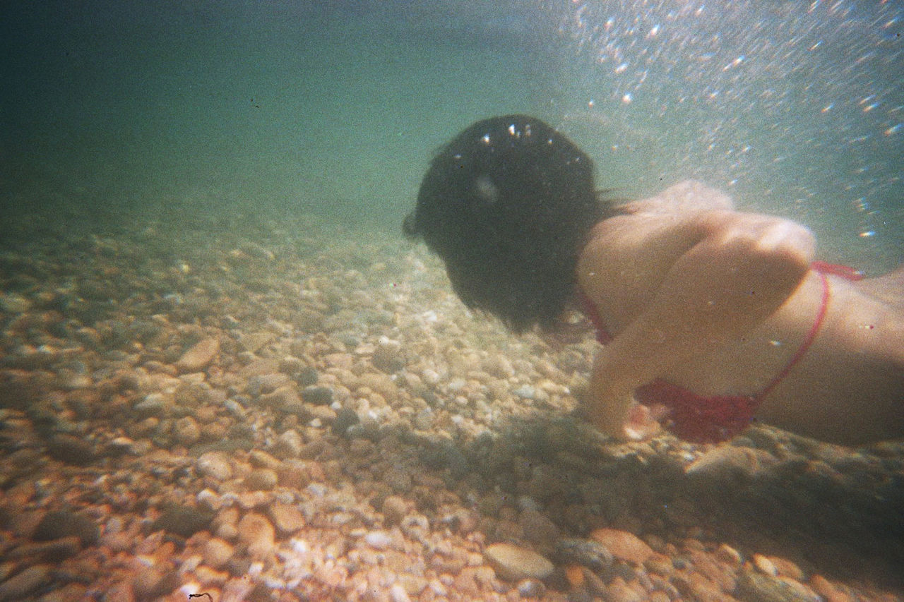 MAN SWIMMING UNDERWATER