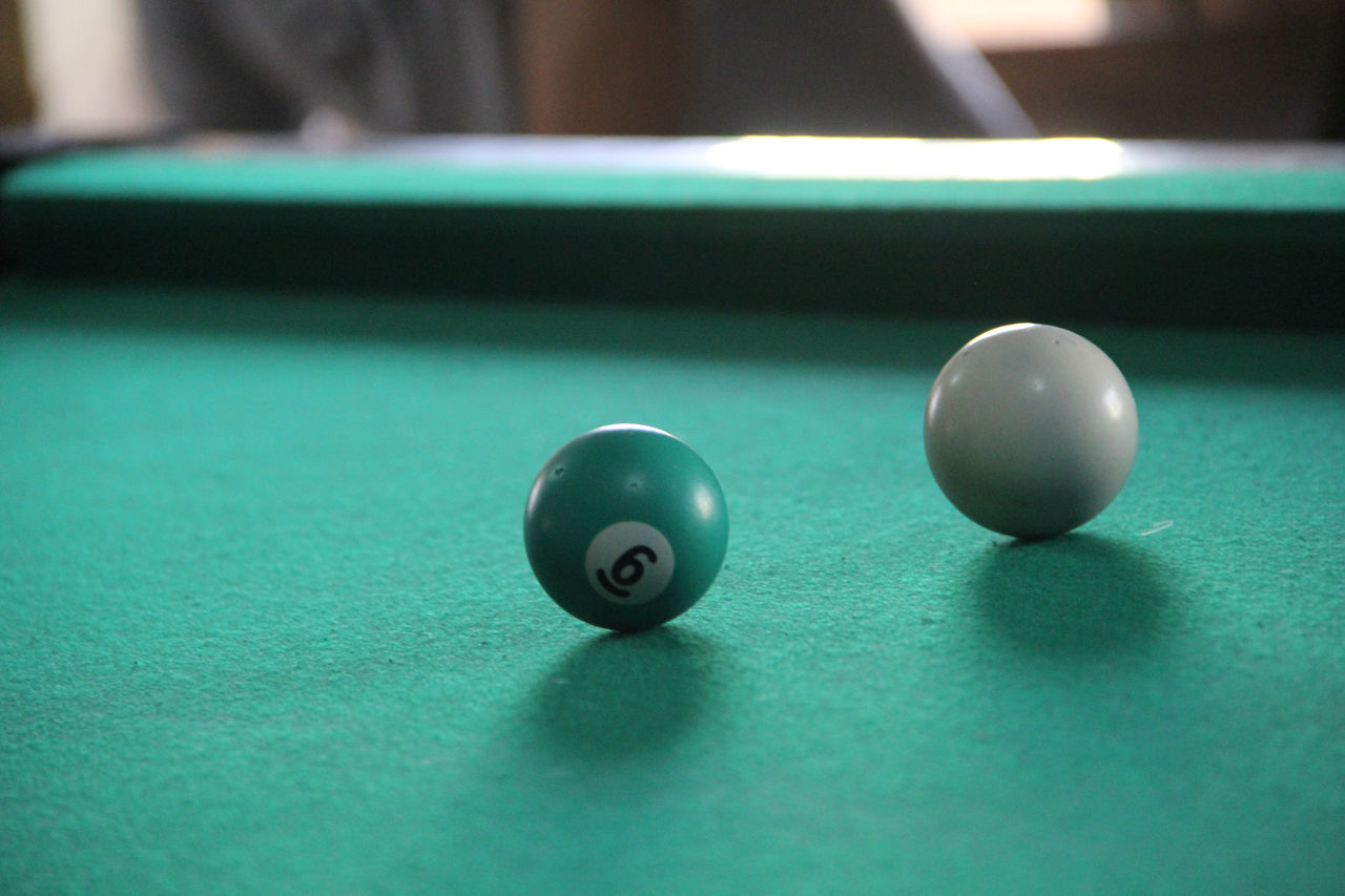 Close-up of pool ball on table