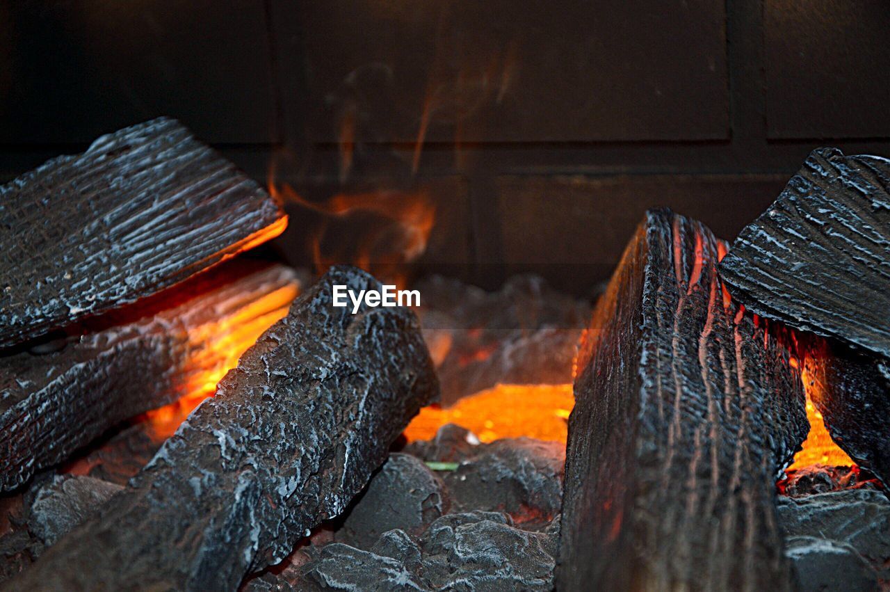 Close-up of firewood at fireplace