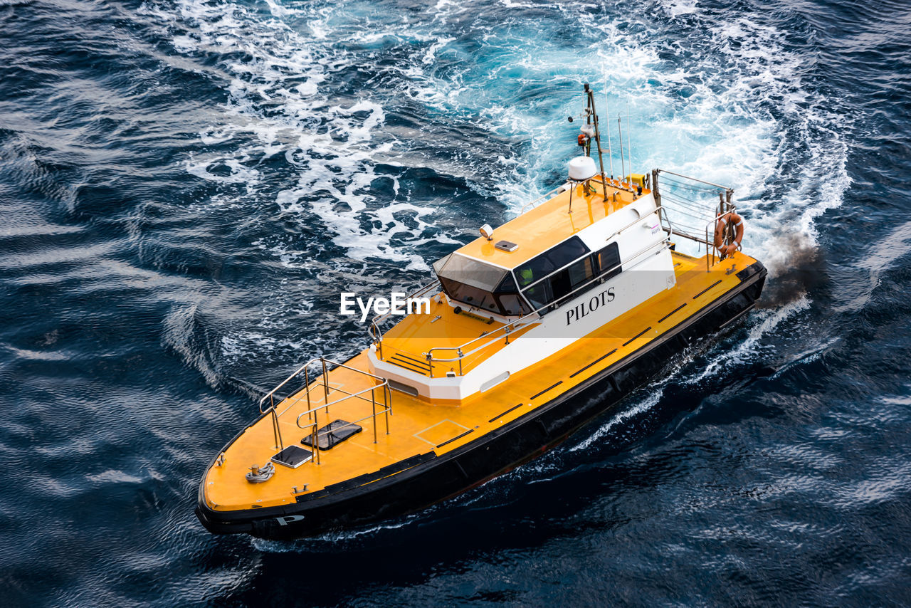 High angle view of yellow ship in sea