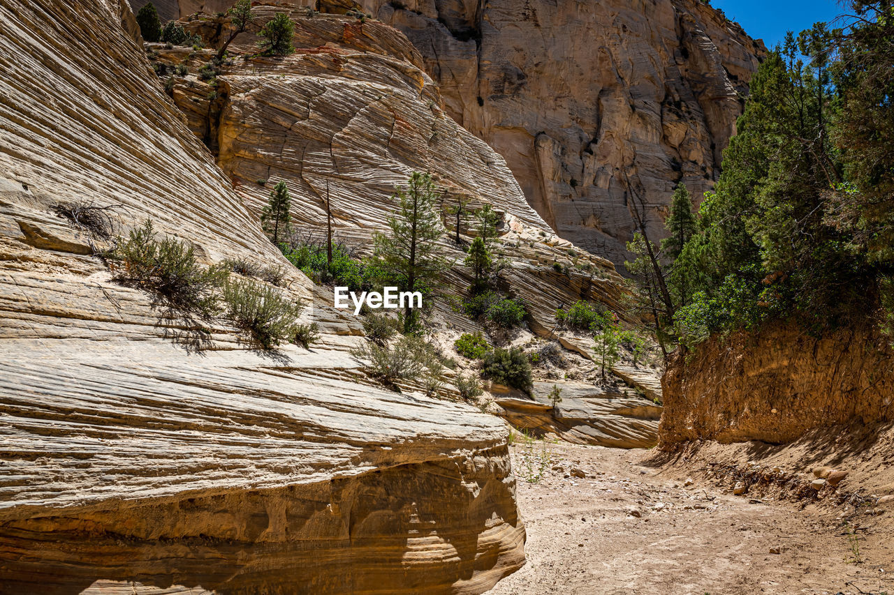 SCENIC VIEW OF ROCK FORMATION ON WATER