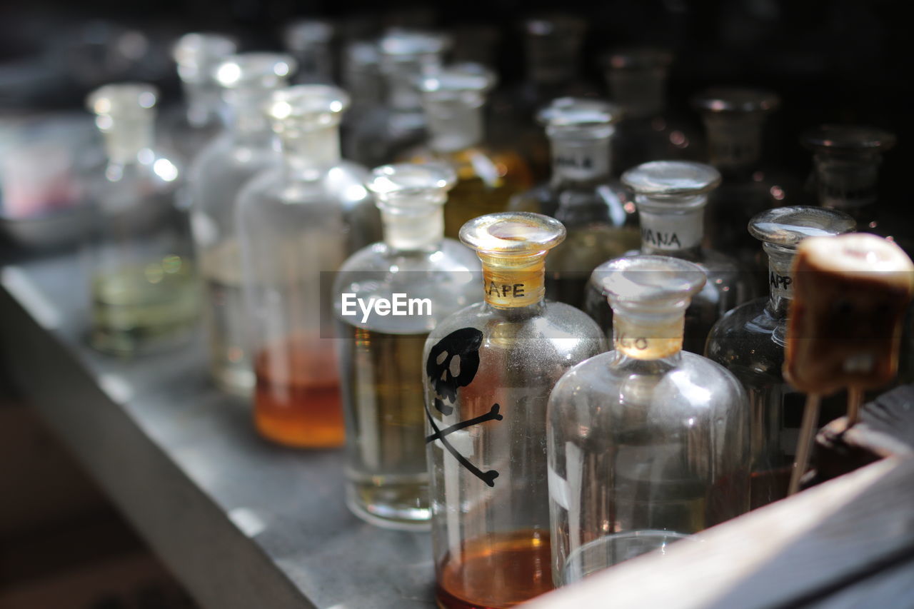 High angle view of medical samples in glass jars