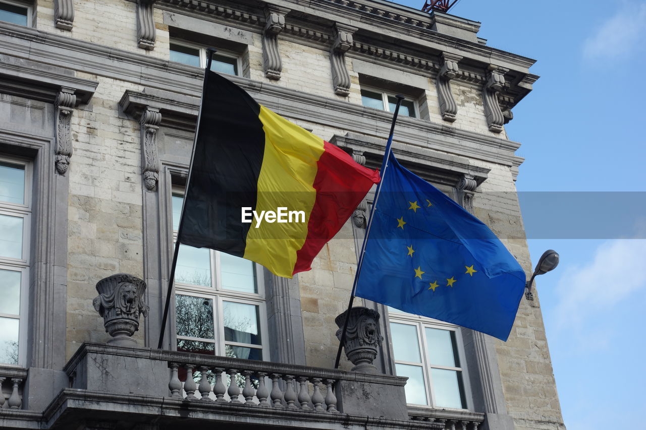 Belgian and european union flags outside the palais de la nation, belgian federal parliament