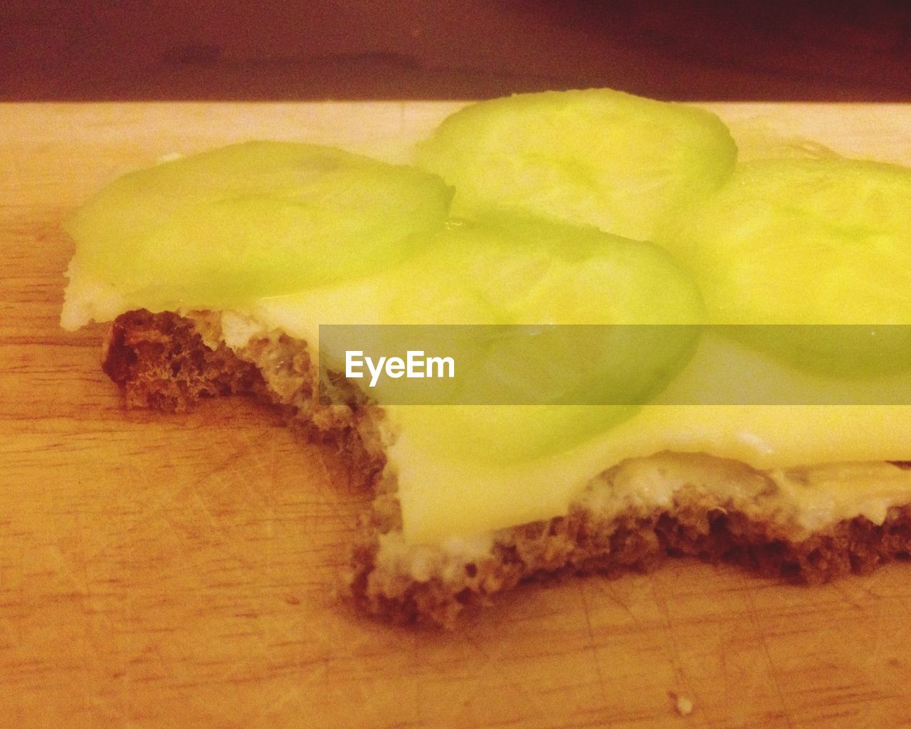 Cheese and cucumber sandwich with tooth marks