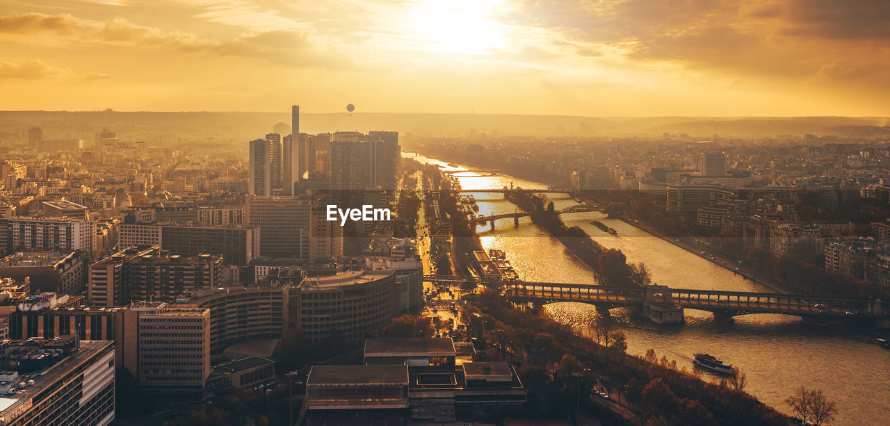 High angle view of city buildings during sunset