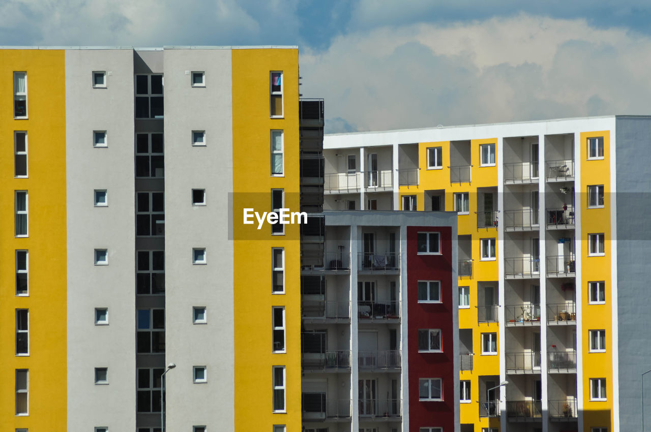 Yellow flat of blocks, residential area, modern neighborhood in brasov, romania