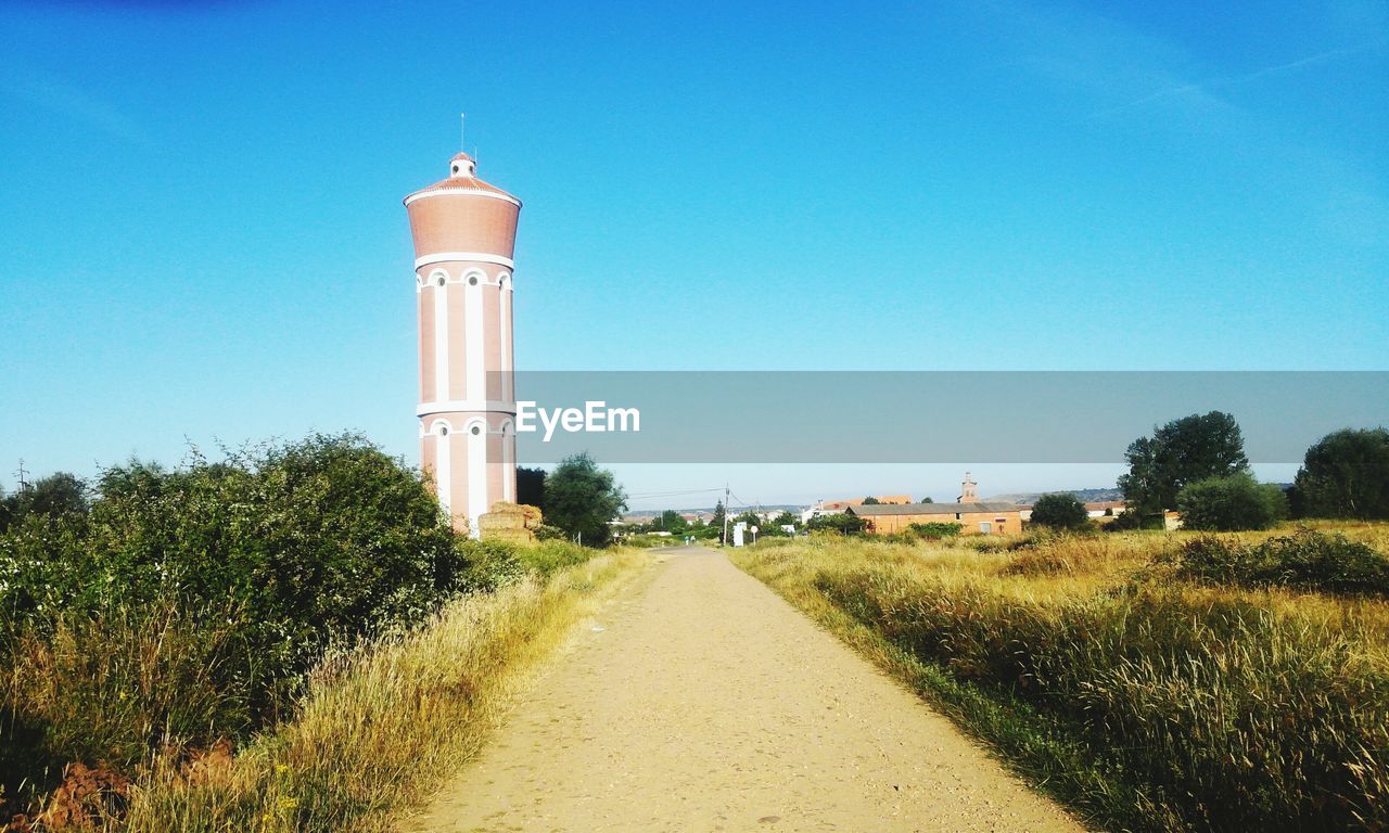 View of lighthouse against clear blue sky