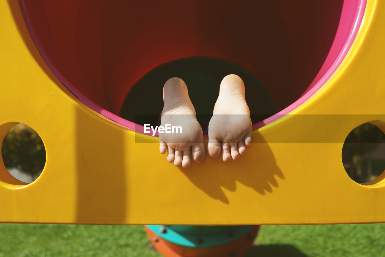 Low section of boy on play equipment