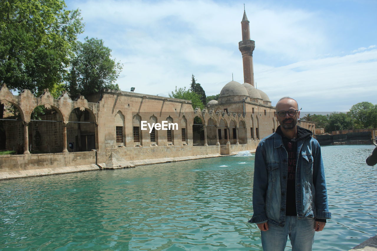 Front view of man standing in water