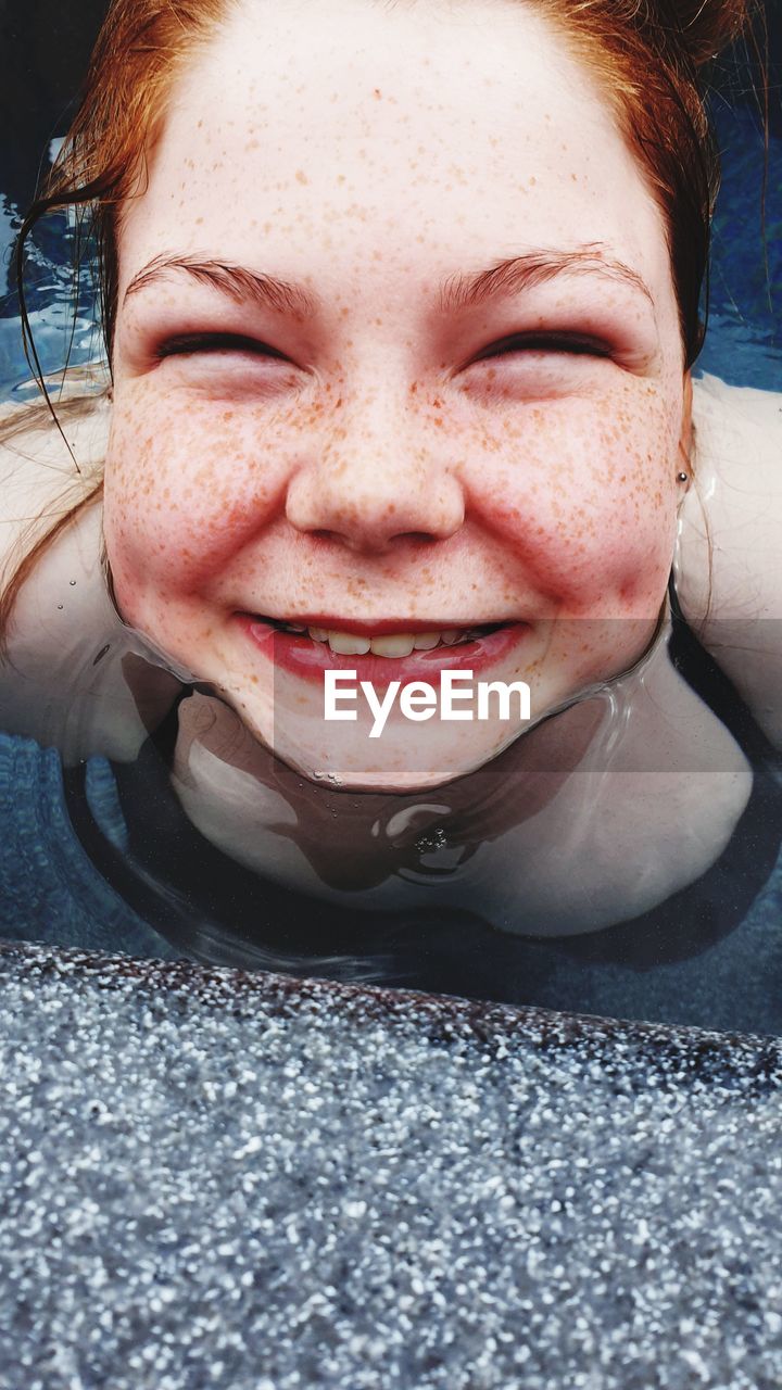 Close-up portrait of smiling girl 