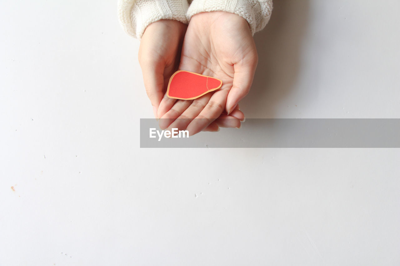 hand, finger, one person, indoors, copy space, studio shot, adult, women, human leg, close-up, white background, positive emotion, limb, nail, pink, emotion, creativity