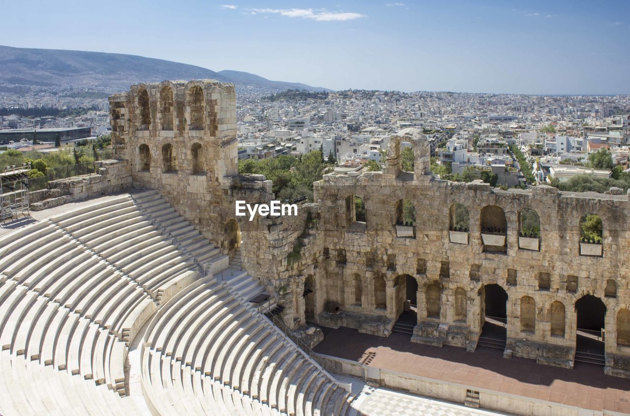 High angle view of old ruins in city against sky