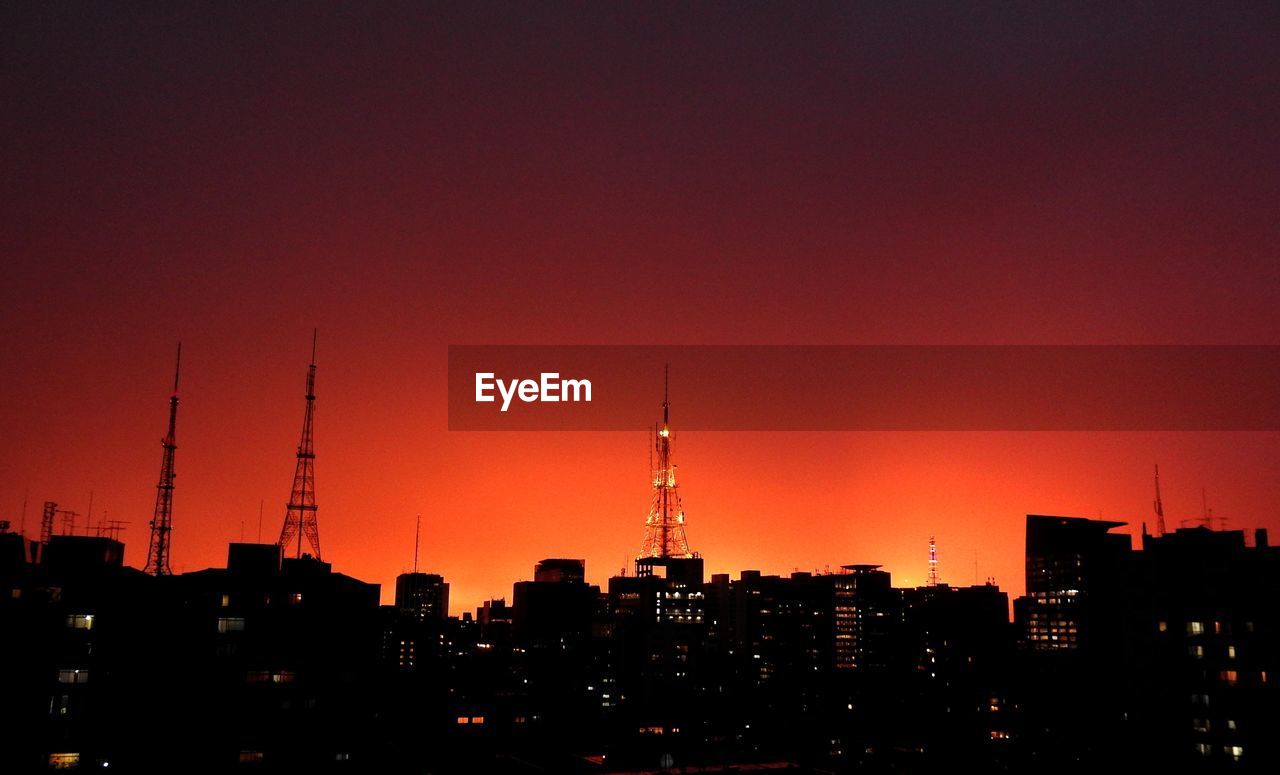 Silhouette of city at sunset