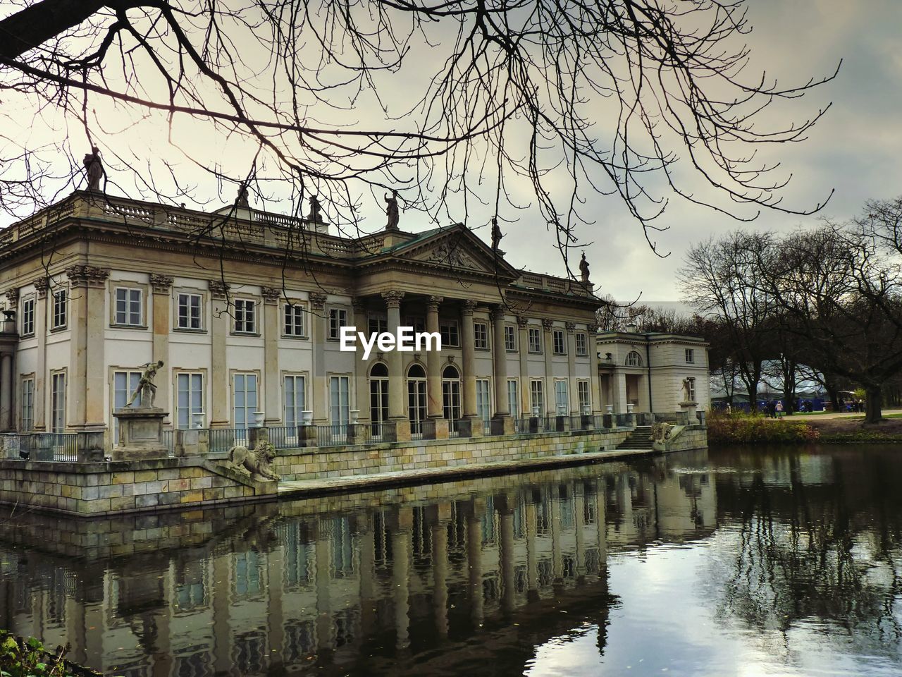 REFLECTION OF BUILDINGS IN PUDDLE